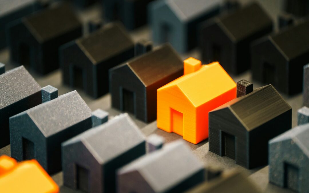 A single, bright house stands out from the rest.